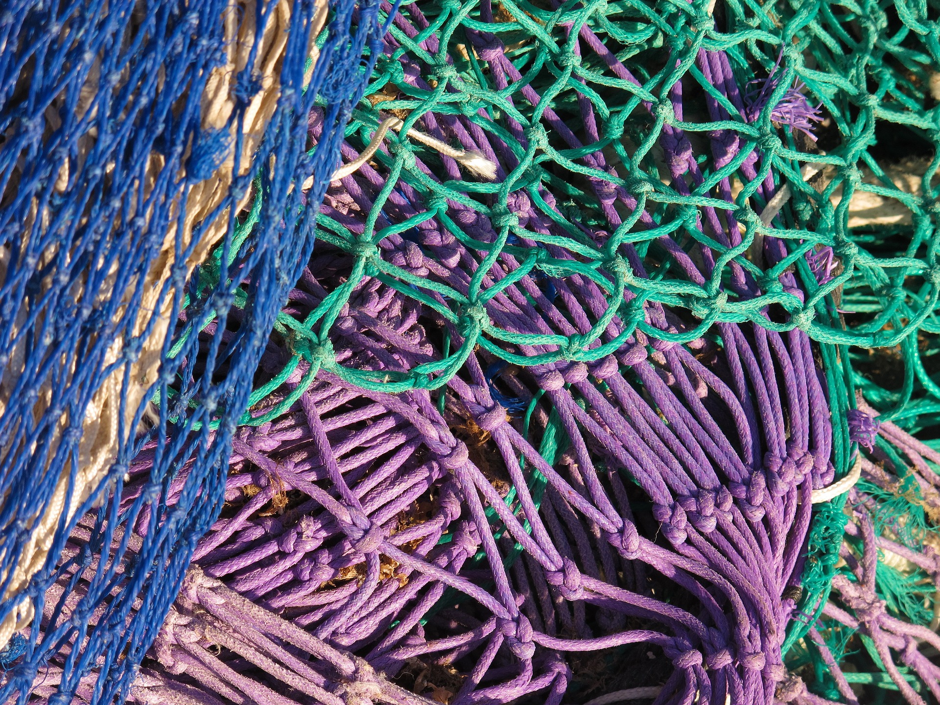 pile of brightly colored fishing nets